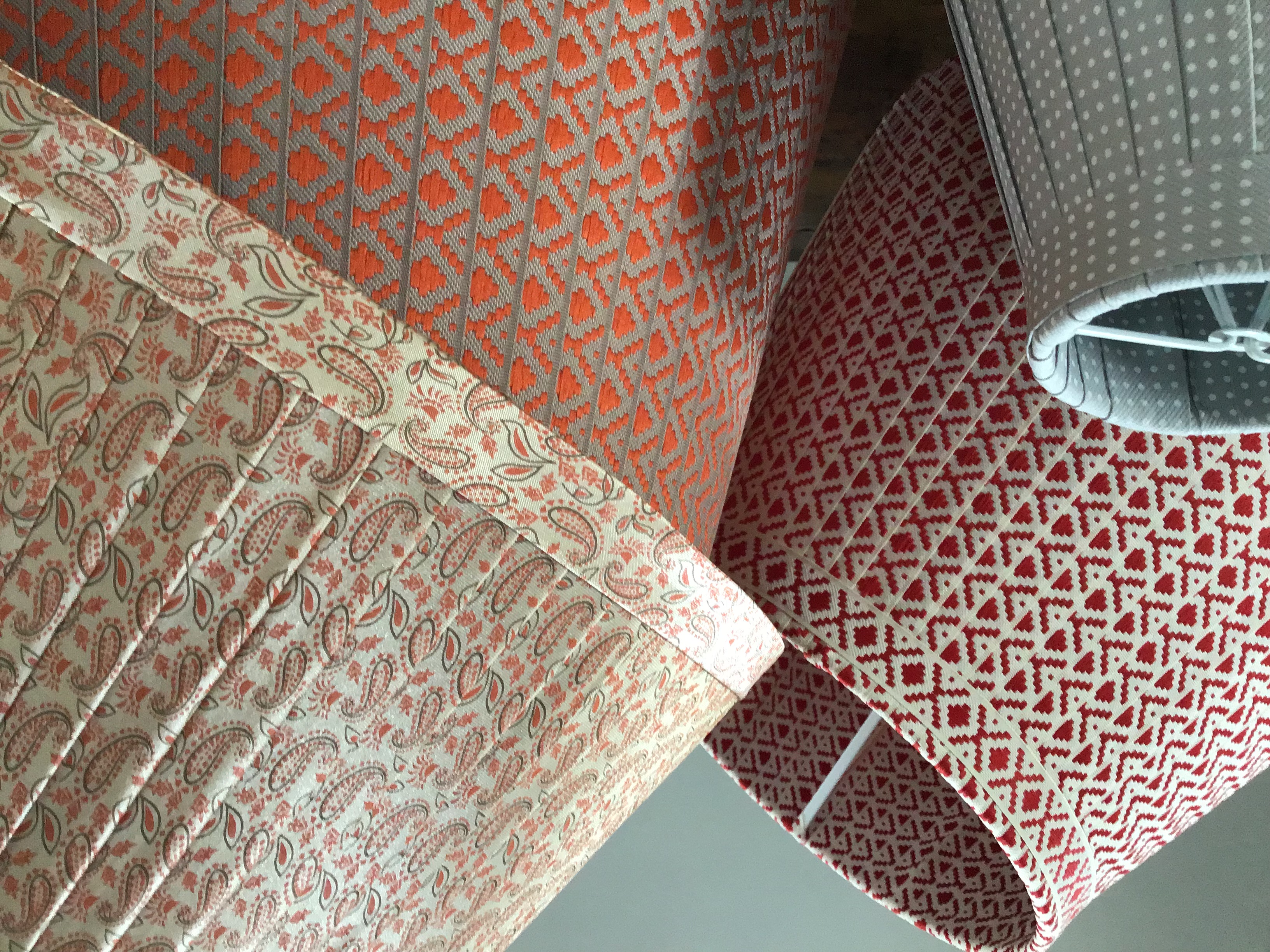 Close up of orange and red ribbon lampshades